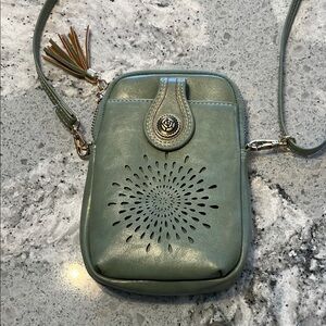 Aphison Green Mini Backpack/Crossbody Bag with adjustable straps.